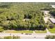 Aerial view showcasing a wooded property next to HWY 521, offering privacy and convenience at 1738 Charlotte Hwy, Lancaster, SC 29720