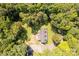 Stunning aerial view of home surrounded by lush green trees and a well-maintained yard at 1738 Charlotte Hwy, Lancaster, SC 29720