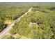 Aerial view of wooded property with mature trees, close to HWY 521, highlighting its natural setting and accessibility at 1738 Charlotte Hwy, Lancaster, SC 29720