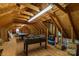Large unfinished attic featuring foosball and pool tables on the wood floor at 1738 Charlotte Hwy, Lancaster, SC 29720
