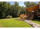 Expansive backyard with a well-maintained wooden deck and landscaped garden, perfect for outdoor enjoyment at 1738 Charlotte Hwy, Lancaster, SC 29720