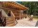 Inviting covered wooden deck with ceiling fan, wood railings and stairs, perfect for outdoor relaxation and entertaining at 1738 Charlotte Hwy, Lancaster, SC 29720