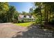 Attractive one-story home with a welcoming front porch and spacious driveway at 1738 Charlotte Hwy, Lancaster, SC 29720