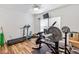 Well-equipped home gym featuring various exercise machines and wood-look flooring at 1738 Charlotte Hwy, Lancaster, SC 29720