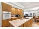 Well-lit kitchen features light wood cabinets, a large island, and modern appliances at 1738 Charlotte Hwy, Lancaster, SC 29720