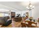 Open-concept living room with a stone fireplace, dining area, and abundant natural light at 1738 Charlotte Hwy, Lancaster, SC 29720