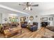 Bright living room showcasing wood flooring, a ceiling fan, and an open layout at 1738 Charlotte Hwy, Lancaster, SC 29720