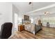 Inviting main bedroom with hardwood floors, a ceiling fan, and neutral decor at 1738 Charlotte Hwy, Lancaster, SC 29720