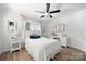 Charming bedroom featuring a ceiling fan, desk, and bedside table at 18679 Vineyard Point Ln, Cornelius, NC 28031