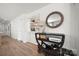 Hallway with built-in shelves and drawers, stylish decor, and a decorative wooden-framed mirror at 18679 Vineyard Point Ln, Cornelius, NC 28031