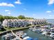 Gorgeous aerial view of condos with private docks, serene waterfront, and community charm at 18679 Vineyard Point Ln, Cornelius, NC 28031