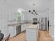 Bright kitchen featuring stainless steel appliances, granite countertops, and an island at 19746 Valiant Way, Cornelius, NC 28031