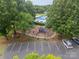 Aerial view of the community playground with an adjacent parking area and trees at 211 Tyndale Ct, Waxhaw, NC 28173