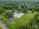 Aerial view of the community pool, clubhouse, tennis courts, and basketball court at 211 Tyndale Ct, Waxhaw, NC 28173