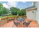 View of the back deck with outdoor furniture overlooking a large yard with mature trees and a storage shed at 211 Tyndale Ct, Waxhaw, NC 28173