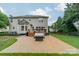 Spacious backyard stone patio with outdoor seating and a grill area, perfect for entertaining at 211 Tyndale Ct, Waxhaw, NC 28173