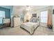 Bright bedroom features windows with views, a ceiling fan and carpeted floors at 211 Tyndale Ct, Waxhaw, NC 28173