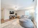 Bonus room with laminate floors, couch, TV, and a gray beanbag chair at 211 Tyndale Ct, Waxhaw, NC 28173