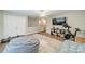 Bonus room featuring a couch, exercise equipment, and laminate wood flooring at 211 Tyndale Ct, Waxhaw, NC 28173