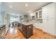 Updated kitchen boasting granite countertops, custom cabinets, and dining area access at 211 Tyndale Ct, Waxhaw, NC 28173