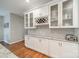 Kitchen with stylish white cabinetry, glass features and granite countertops at 211 Tyndale Ct, Waxhaw, NC 28173