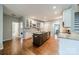 Spacious kitchen featuring an island with seating, granite countertops, and ample cabinet space at 211 Tyndale Ct, Waxhaw, NC 28173