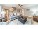 Bright living room with hardwood floors, a comfortable couch, and staircase access at 211 Tyndale Ct, Waxhaw, NC 28173