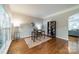 Bright home office with hardwood floors, large windows, and sophisticated decor for a productive workspace at 211 Tyndale Ct, Waxhaw, NC 28173