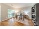 Stylish office with hardwood floors, a modern desk, and large windows offering natural light at 211 Tyndale Ct, Waxhaw, NC 28173