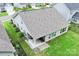 Aerial view of a home with a backyard patio, lush greenery, and a fenced-in yard at 219 Broadleaf Dr, Denver, NC 28037