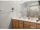Bathroom boasts a double vanity, large mirror, and a shower with glass doors at 219 Broadleaf Dr, Denver, NC 28037