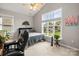 Cozy bedroom with a large window and a comfortable bed with decorative accents at 219 Broadleaf Dr, Denver, NC 28037