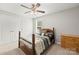 Cozy bedroom with a wooden bed frame, a dresser and a ceiling fan at 219 Broadleaf Dr, Denver, NC 28037