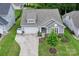 Charming home featuring a well-maintained lawn, two-car garage, and attractive landscaping at 219 Broadleaf Dr, Denver, NC 28037