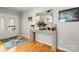 Bright foyer featuring hardwood floors, a decorative console table, and a glass-paneled front door at 219 Broadleaf Dr, Denver, NC 28037