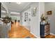 Elegant foyer with hardwood floors, decorative shelving, and stylish decor creating a welcoming entrance at 219 Broadleaf Dr, Denver, NC 28037