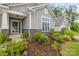 Close up of home exterior showcasing beautiful landscaping and stone accents near the front entrance at 219 Broadleaf Dr, Denver, NC 28037