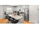 Eat-in kitchen with stainless steel appliances and gray cabinets at 219 Broadleaf Dr, Denver, NC 28037