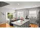 Open concept kitchen and dining area with island and granite countertops at 219 Broadleaf Dr, Denver, NC 28037