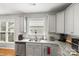 Bright kitchen with stainless steel appliances, granite countertops, and white backsplash at 219 Broadleaf Dr, Denver, NC 28037