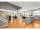 Open-concept living space with hardwood floors connecting the living room, dining area, and kitchen at 219 Broadleaf Dr, Denver, NC 28037