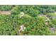Aerial view of the property with a red outline. Features home, outbuildings and surrounding trees at 2289 Mccloud St, Denver, NC 28037