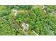 Aerial view with a red outline of the property. Also features, a mobile home, sheds, and a Quonset hut at 2289 Mccloud St, Denver, NC 28037
