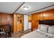 Relaxing bedroom with a warm wooden closet and dresser near a relaxing queen bed at 2289 Mccloud St, Denver, NC 28037