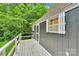 Charming shed with white trim and a wooden deck, surrounded by lush greenery at 2289 Mccloud St, Denver, NC 28037