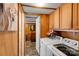 Functional laundry room with washer, dryer, cabinets, and tile flooring at 2289 Mccloud St, Denver, NC 28037