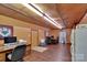 Open living area with wooden-style flooring, built in storage and a refrigerator, great for entertaining at 2289 Mccloud St, Denver, NC 28037