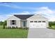 Charming single-story home with a well-maintained lawn, a two-car garage, and pleasing curb appeal at 231 Basildon St # 1021, Lancaster, SC 29720