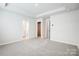 Bright main bedroom boasting carpeted floors, ample space, and en-suite bathroom and walk-in closet access at 2440 Hedgecliff Rd, Kannapolis, NC 28025