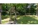 Tree swing in a large grassy backyard partially surrounded by a chainlink fence at 2605 Camelot Dr, Rock Hill, SC 29732
